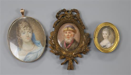 A small 18th century oil on ivory miniature of a lady, 3 x 2.5cm and two other miniatures